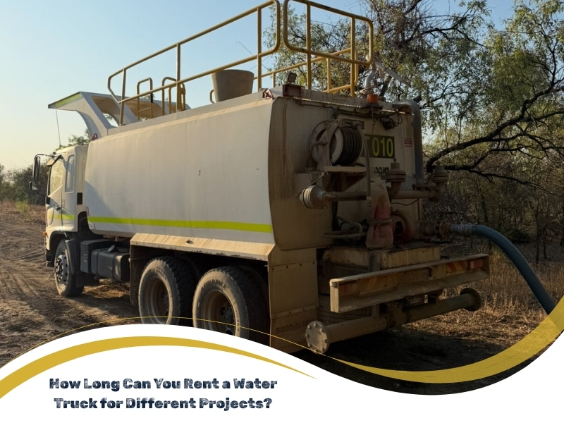 A water truck with hoses and a rear spray system parked on a dirt road. Water truck rental duration varies.